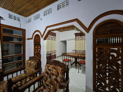 a room with a table and some chairs and a room with a table at SSM GUEST INN in Trincomalee