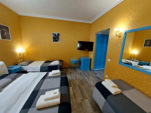 Postel nebo postele na pokoji v ubytování Hotel Positano 2