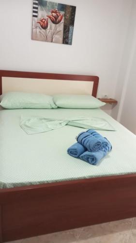 A bed or beds in a room at Primavera Apartments
