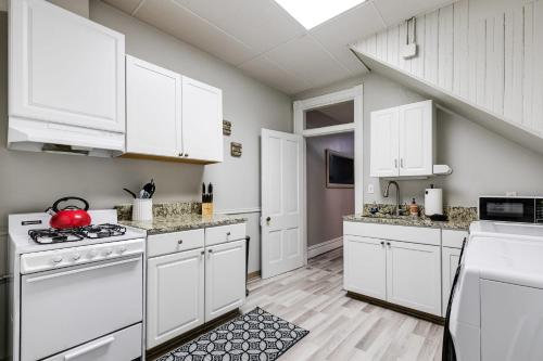 a kitchen with white cabinets and white appliances at M1 central location in the Fan VCU free parking in Richmond