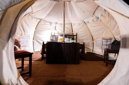 a tent with a table and chairs in it at Woodland View - Sleeps up to 2, double bed in Dungarvan