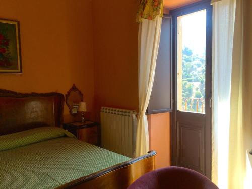 Postel nebo postele na pokoji v ubytování Palazzo Cutrufelli