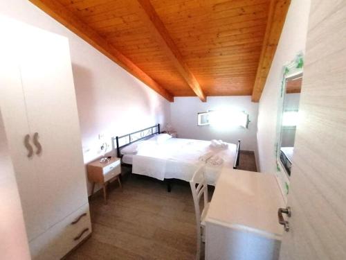 Postel nebo postele na pokoji v ubytování Appartamenti Borgo Ciaramiti.