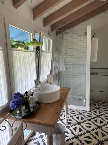 a bathroom with a large sink and a shower at Casa Pepin in Posada