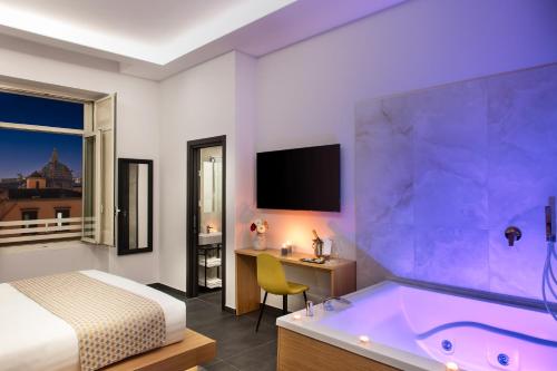 a hotel room with a bed and a tub at MAIN - Duomo in Naples