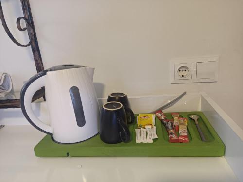 a kitchen counter with a tea kettle and other utensils at ENA Serenity Boutique Hotel Ephesus in Selcuk