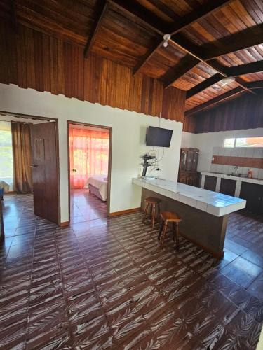 a large room with a large table and a couch at Cabinas Selva Verde in Monteverde Costa Rica