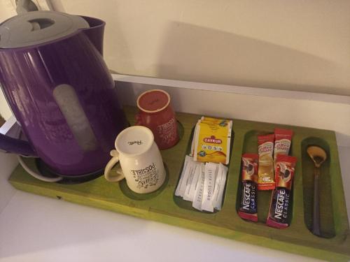 a green tray with some food and a purple blender at ENA Serenity Boutique Hotel Ephesus in Selcuk