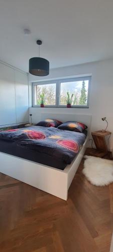 a bedroom with a bed in a room at Small Lake Apartment in Bergisch Gladbach