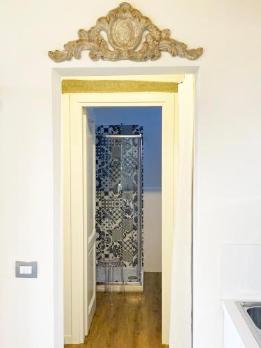 a doorway with a glass door in a room at Oliveta blu in Siena
