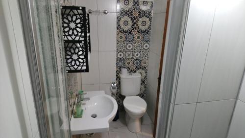a small bathroom with a toilet and a sink at ENA Serenity Boutique Hotel Ephesus in Selcuk