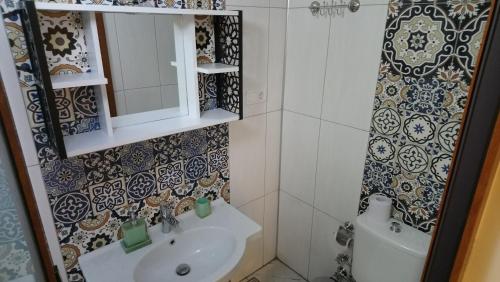 a bathroom with a sink and a mirror at ENA Serenity Boutique Hotel Ephesus in Selcuk