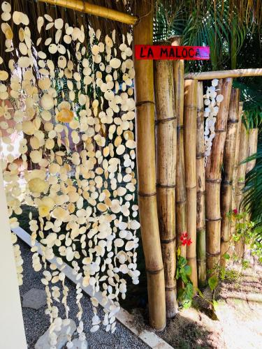 a bunch of logs leaned up against a wall at Villa Clarissa No. 8 in Las Terrenas