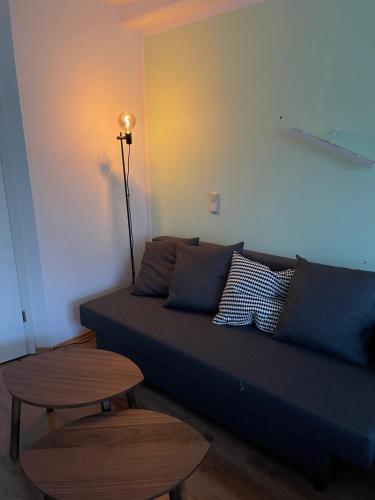 a living room with a couch and a table at MY HOME 4 person apart in Chemnitz
