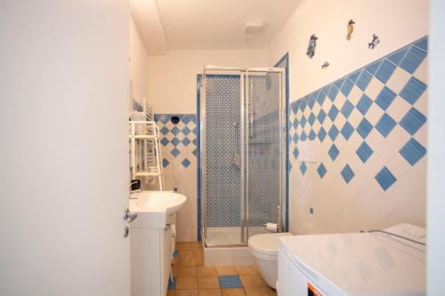 a bathroom with a shower and a toilet and a sink at Amalfi e Positano Home in Salerno