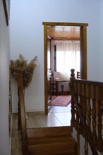 a stairway leading to a room with a window at As e vogël, As e madhe in Ersekë