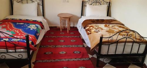 Postel nebo postele na pokoji v ubytování Auberge l'avenir