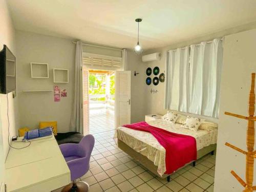 Кровать или кровати в номере Casa a 170m da praia com vista pro mar