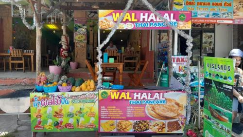 a wall halal food stand in front of a store at Kantiang Beach Apartments in Ban Ru Yai