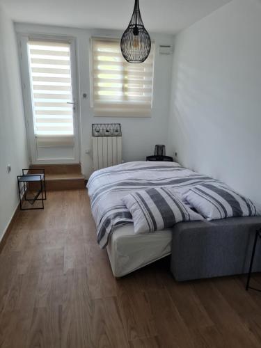 En eller flere senge i et værelse på Happy Home