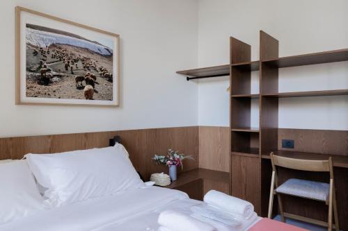 a bedroom with a bed and a book shelf at Zita Beirut in Beirut
