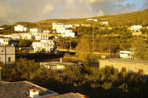 a city with white buildings on a hill at Casa Mamica Rosario in Yegen