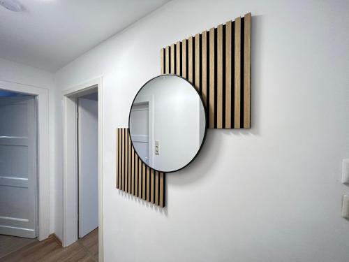a mirror on a wall in a room at JAVU Restaurant & FeWo in Iserlohn