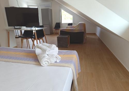 a hotel room with a bed and a living room at Residenza delle Nazioni in Gatteo a Mare