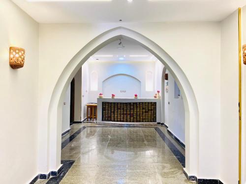 an arched hallway with an altar in a building at New Abusimble 2 Hotel & Restaurant in Abu Simbel