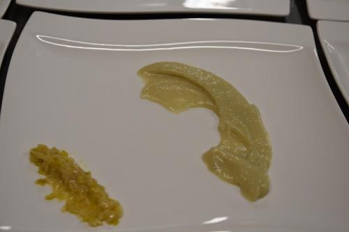 a white plate with green peppers on it at Agriturismo Poggio ai Legni in Sovicille
