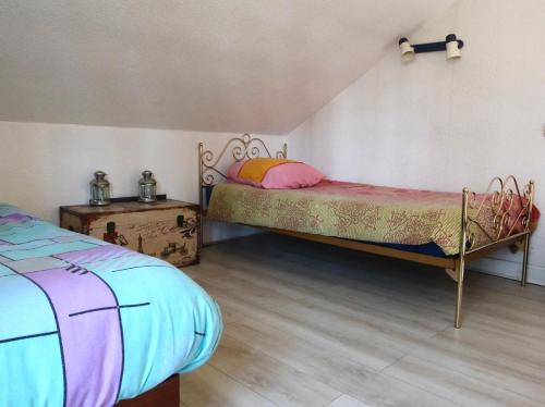 Ein Bett oder Betten in einem Zimmer der Unterkunft La Faisanderie