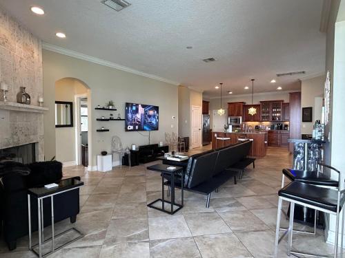 a living room with a couch and a fireplace at Florida Space Coast Waterfront Retreat in Cocoa