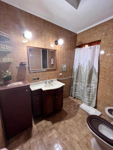 a bathroom with a sink and a shower at La casa de Ana in Alberti