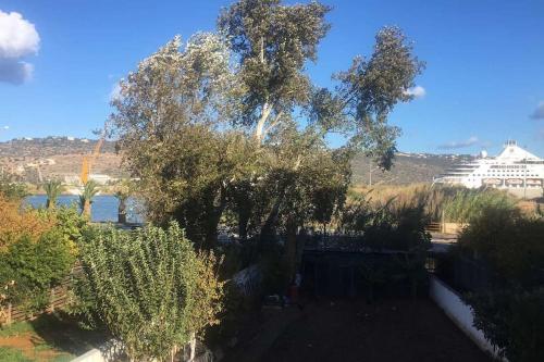 a view of a river and a cruise ship at Bayside Apt. in Souda