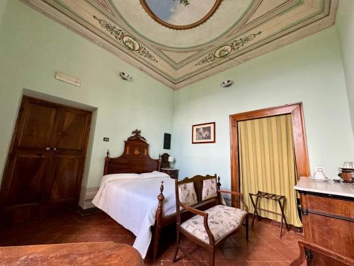 a bedroom with a bed and a coffered ceiling at Villa Dell'Annunziata in Rieti