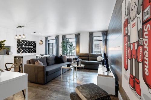 a living room with a couch and a table at LiV MTL Urban in Montréal