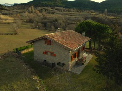 an aerial view of a small house in a field at Cal Pujol by Rural House in Toloríu