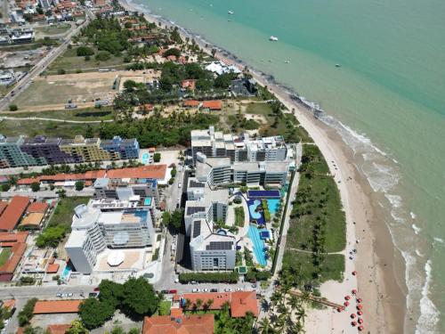 an aerial view of a beach with buildings at Flat Praiano Aconchegante in Cabedelo