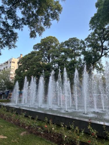 a fountain in a park with trees in the background at Mendoza Departamento Pleno Centro in Mendoza