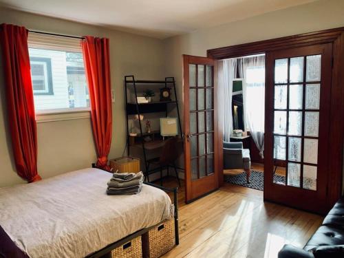 a bedroom with a bed and a living room at Comfy Studio #3, Central Location, Parking in Halifax