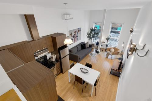 an overhead view of a living room and a living room at LiV MTL Main in Montréal