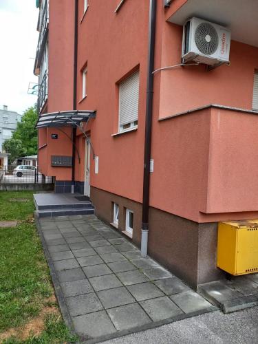 a building with a air conditioner on the side of it at Apartments with a parking space Zagreb - 22231 in Zagreb