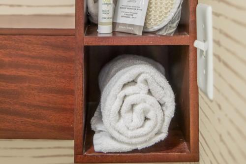 a roll of towels in a wooden cabinet at Residence Inn by Marriott Amelia Island in Fernandina Beach