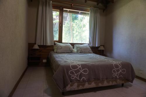 Een bed of bedden in een kamer bij Las Lambertianas