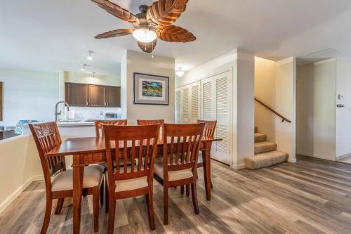 a dining room and kitchen with a table and chairs at Kaanapali Royal Q302-Oceanview spacious 2 bedroom Kaanapali Royal gem in Lahaina