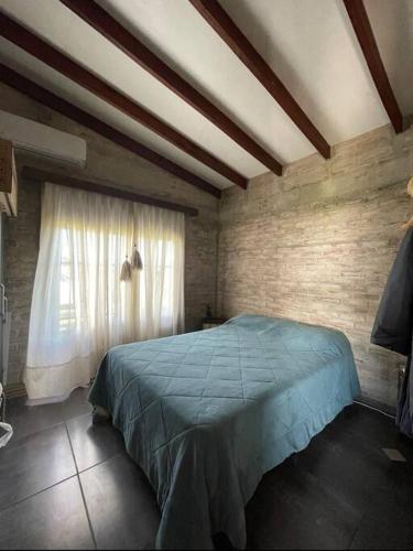 Una cama o camas en una habitación de Chacra El Timbó