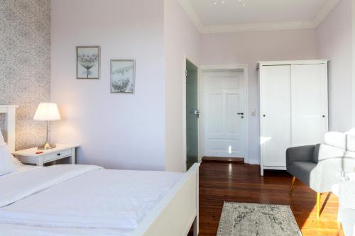 Ένα ή περισσότερα κρεβάτια σε δωμάτιο στο Hotel Villa Wahnfried Thiessow