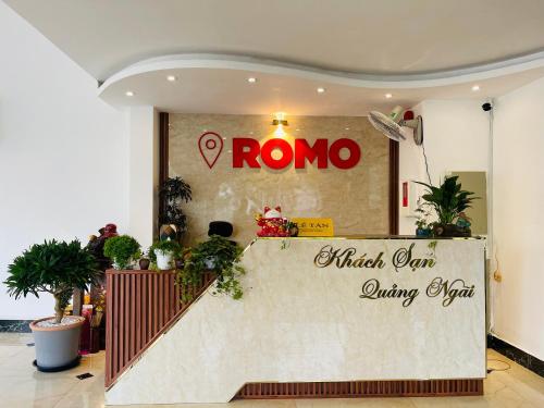 a restaurant with a roma sign on the wall at KHÁCH SẠN ROMO in Quang Ngai