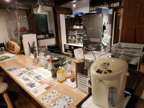 a counter in a store with a machine on it at Tototo Morioka in Morioka