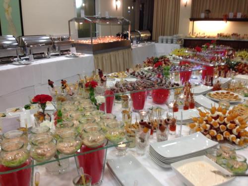 a buffet line with many different types of food at Victoria Hotel in Minden
